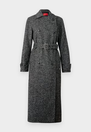 Houndstooth wollen jas met een dubbele knopenrij, een ceintuur in de taille en lange mouwen. Kleurenschema bevat zwart en grijs met een getextureerde stof.