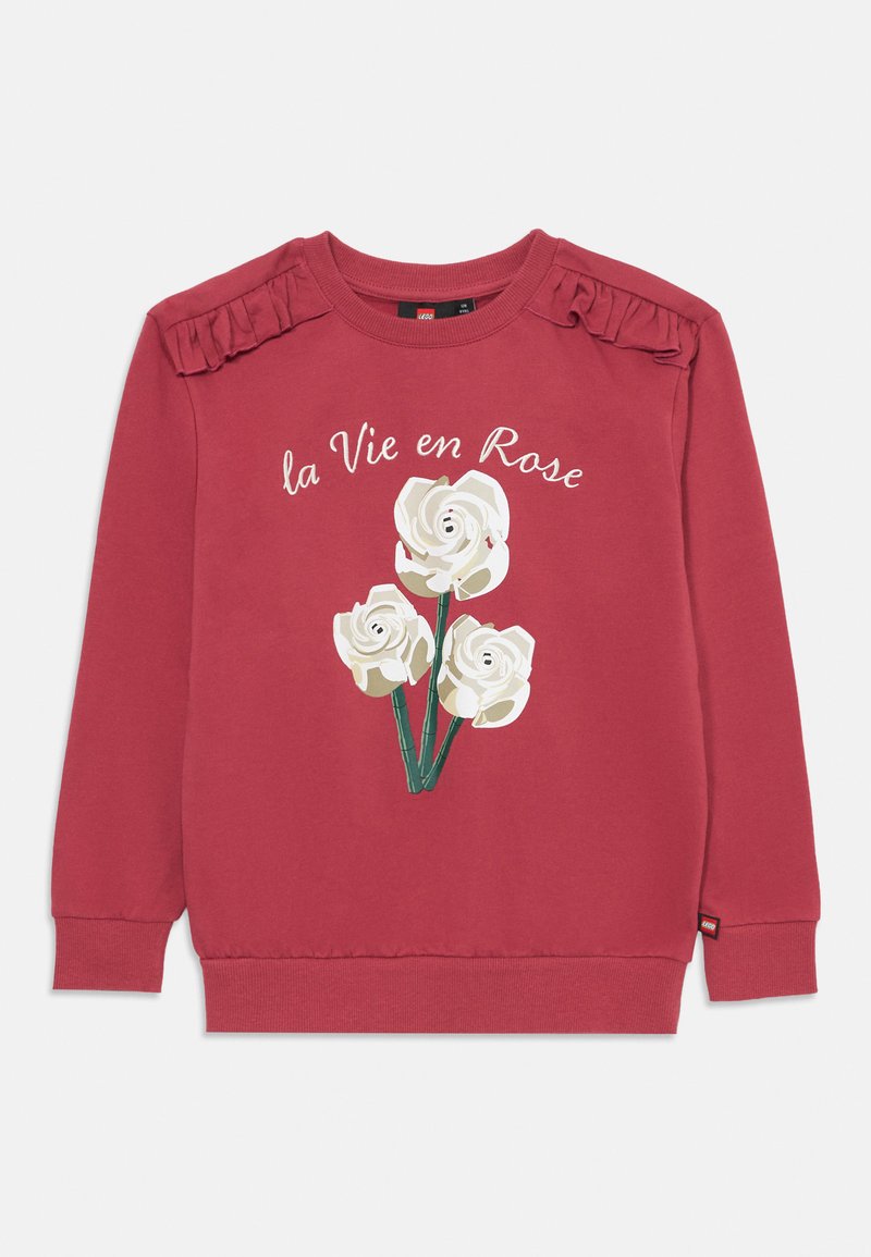 Červená mikina se žebrovanými manžetami a výstřihem, s květinovým vzorem bílých růží a textem "la Vie en Rose." Rukávy s volánkovými akcenty.
