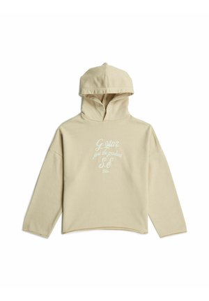 Beige hooded sweatshirt with long sleeves and white cursive text "G-star just the product S.E." printed on the front.
