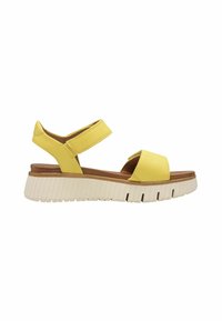 Sandali in pelle gialla con due cinghie, una fascia larga per le dita e una suola spessa e rigata bianca. Il design è aperto e traspirante.
