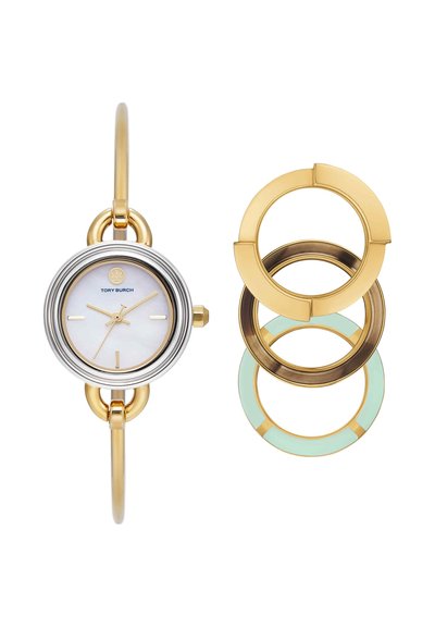 Montre-bracelet Tory Burch ton or et argent avec cadran blanc, aiguilles dorées et trois lunettes circulaires interchangeables en or, bronze et menthe.
