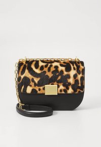 Leopard print handbag with black leather bottom, gold hardware, and a chain strap. Textured fur-like fabric on top. Rectangular shape.