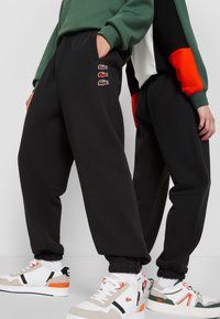 Lacoste EXCLUSIVE UNISEX - Tréningruha alsók - black
