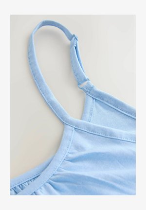 Gaiši zils kokvilnas tops ar šaurām lencītēm, rievotu tekstūru pie krūtīm un mīkstu audumu. Ir regulējama lencītes cilpa.