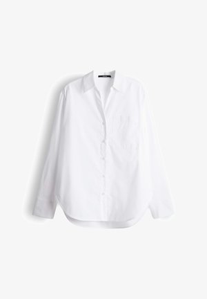 Weißes langärmliges Hemd mit Knopfleiste, spitzem Kragen, einer Brusttasche und abgerundetem Saum. Hergestellt aus glattem Baumwollstoff.