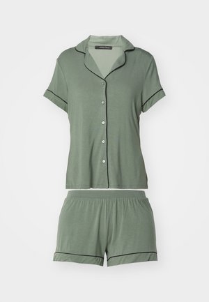 Green short-sleeve pajama set with black piping, featuring a button-up top and elastic waistband shorts, made from soft fabric.