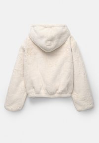Giacca corta color crema realizzata in morbido tessuto peloso. Presenta un cappuccio, maniche lunghe e una vita elastica.