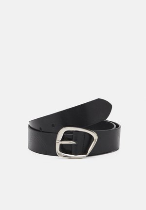 Black leather belt coiled with a silver irregular-shaped metal buckle and three visible adjustment holes on plain background.