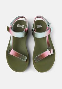 Pair of olive green sandals with adjustable pastel pink and blue straps, labeled "Camper" on left and "Twins" on right footbed.