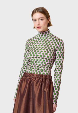 Long-sleeve top with a high collar, featuring a green and pink geometric pattern, paired with a brown, textured, elastic-waist skirt.