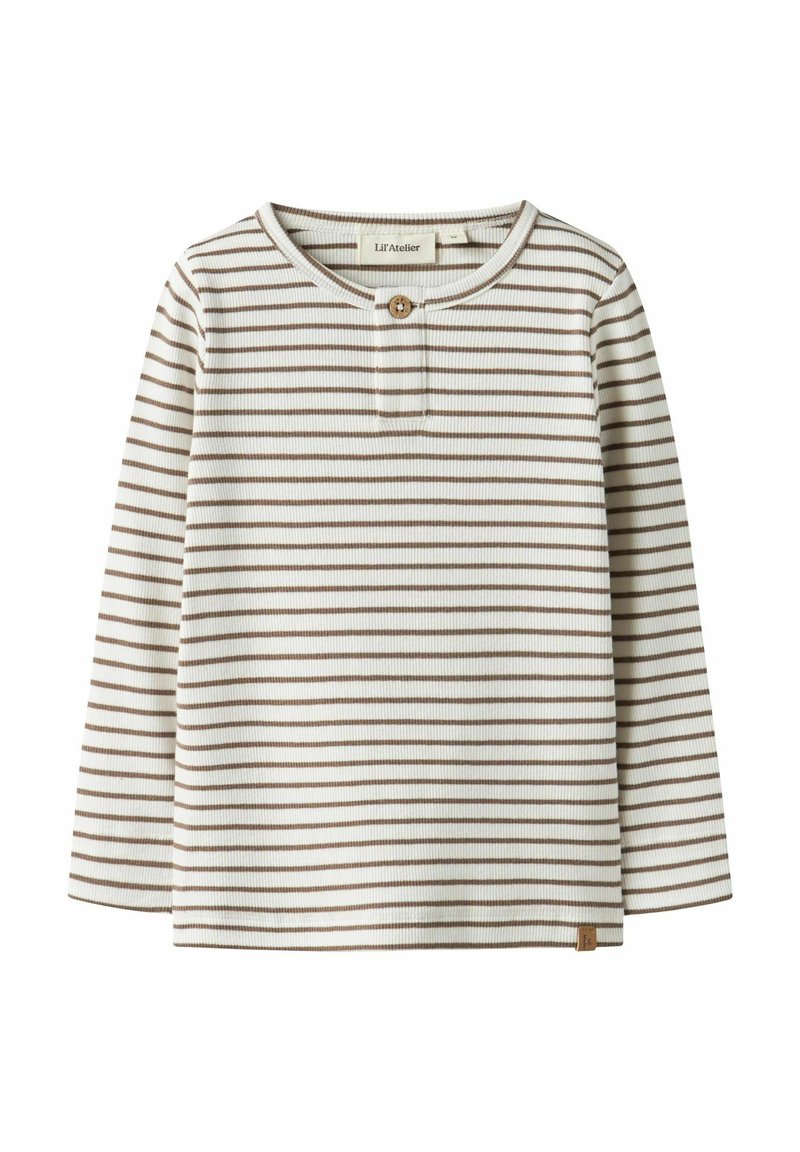 Bluzka w paski z długim rękawem w kolorach kremowym i brązowym. Posiada zapinaną na guziki listwę, prążkowaną fakturę oraz małą metkę z logo przy krawędzi.