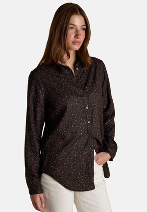 Black button-up shirt with a subtle leopard print pattern, made of smooth fabric, featuring a pointed collar and long sleeves.