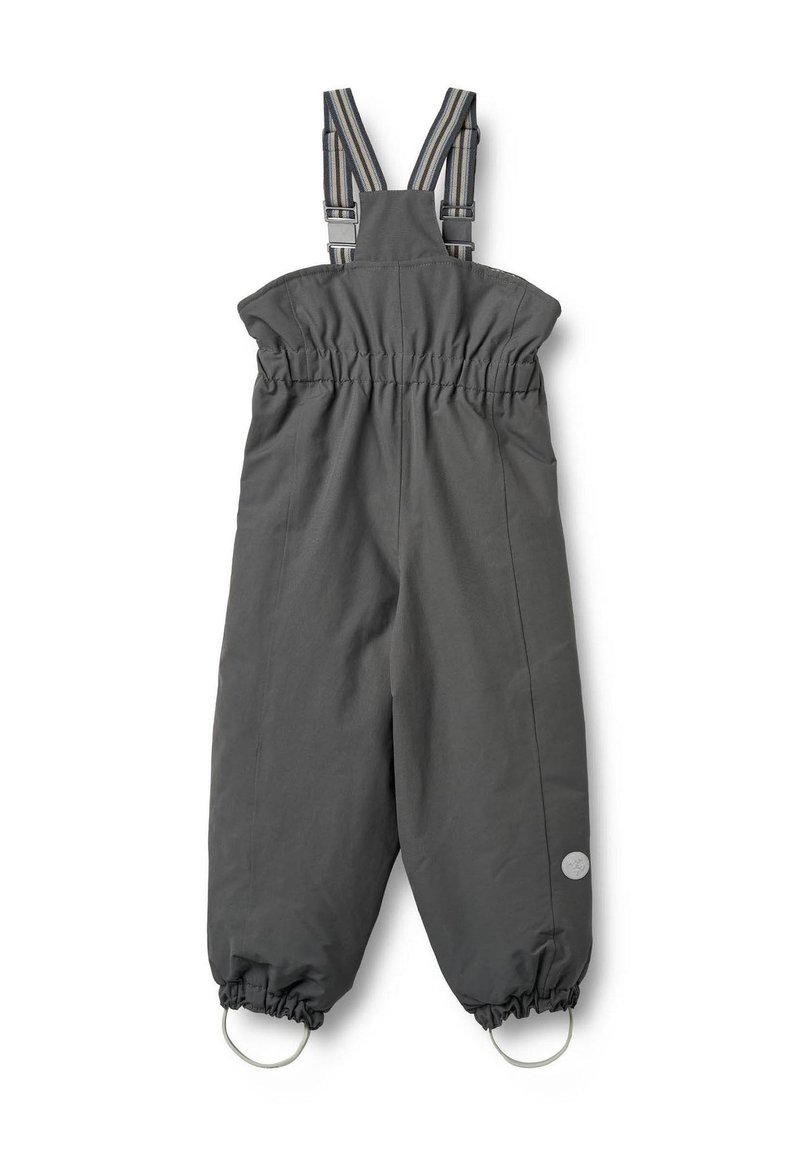 Harmaat vedenkestävät haalarit, jotka on valmistettu kestävästä kankaasta. Haalarissa on säädettävät raidalliset olkahihnat, joustava vyötärö ja joustavat hihansuut lenkeillä.