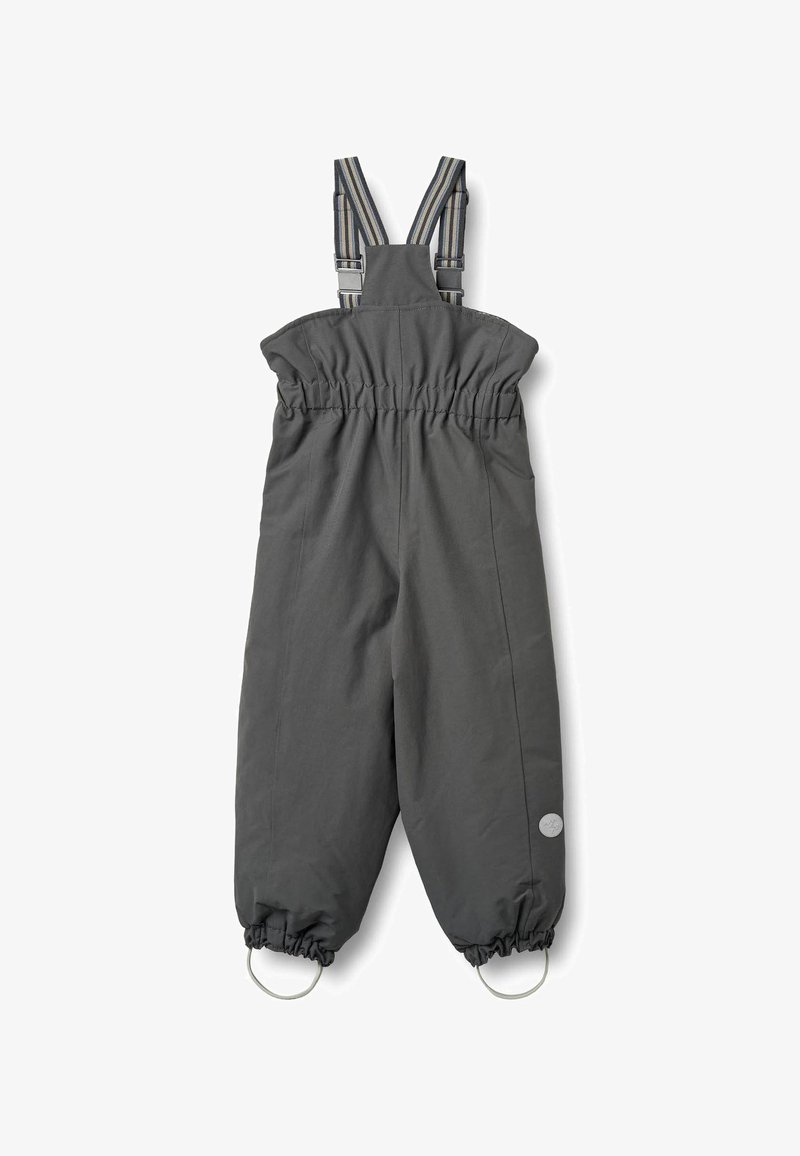 Harmaat vedenkestävät haalarit, jotka on valmistettu kestävästä kankaasta. Haalarissa on säädettävät raidalliset olkahihnat, joustava vyötärö ja joustavat hihansuut lenkeillä.