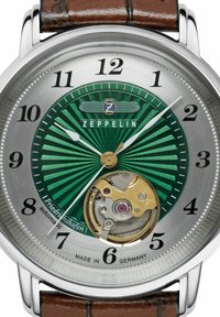 Zeppelin automatic watch with a green sunburst dial, silver stainless steel case, brown leather strap, and visible mechanical movement details.