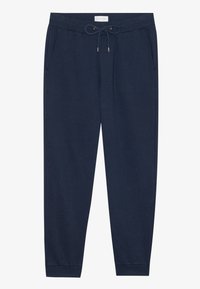Marina blå joggingbyxor med elastisk midja och snörning, sidofickor och avslutade anklar, utlagda platta.