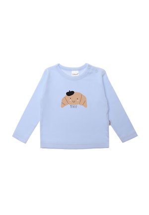 Helle blaue Langarmbluse aus Baumwolle, mit einem Cartoon-Croissant-Graphic mit einem Hut und dem Text "Bonjour, petit croissant" darunter.