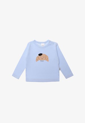 Light blue long-sleeve shirt made of cotton, featuring a cartoon croissant graphic with a hat, and text "Bonjour, petit croissant" below.