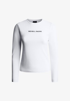 Biała dopasowana koszula z długim rękawem z napisem "RED BULL RACING" na środku klatki piersiowej, czarnymi, wielkimi literami.