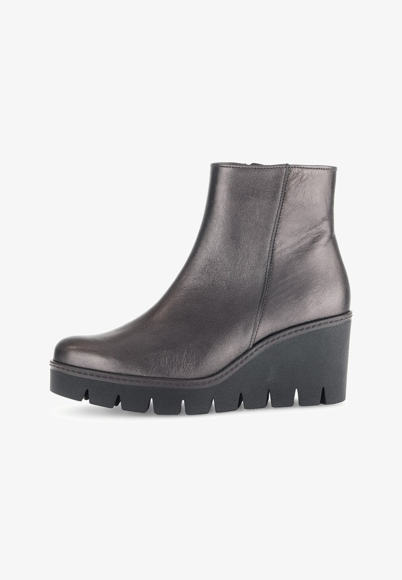 Black leather ankle boot with a smooth finish, featuring a wedge sole, rounded toe, and a textured platform for added height and stability.