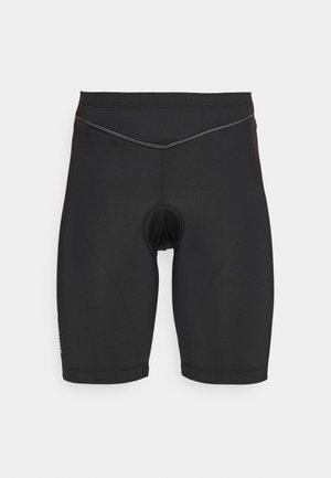 Black cycling shorts made of stretchy fabric, featuring a padded insert, fitted design, and a contrasting stitch detail along the waistline.