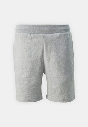 Sivé bavlnené šortky s elastickým pásom, ktoré majú jemnú štruktúru a jedno logo umiestnené na dolnej prednej ľavej nohe.