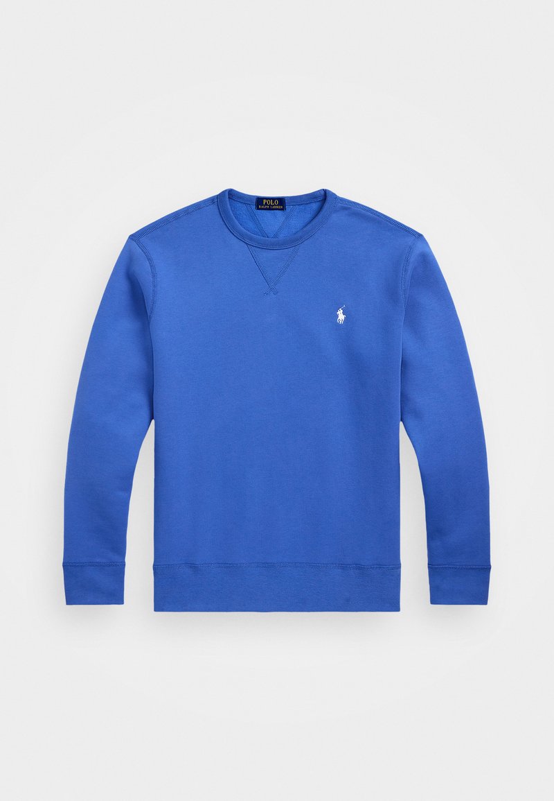 Blå sweatshirt gjord av mjukt tyg med rundad hals, långa ärmar och ribbade muddar. Har en liten vit logotyp på bröstet.