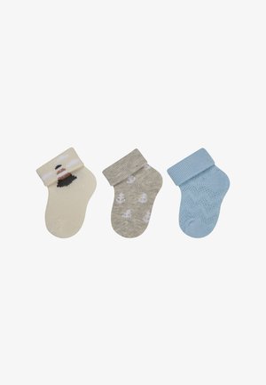 Drei Paar Socken: cremefarben mit Leuchtturm-Motiv, grau mit weißen Ankern und hellblau mit strukturiertem Muster; alle mit gerippten Bündchen.