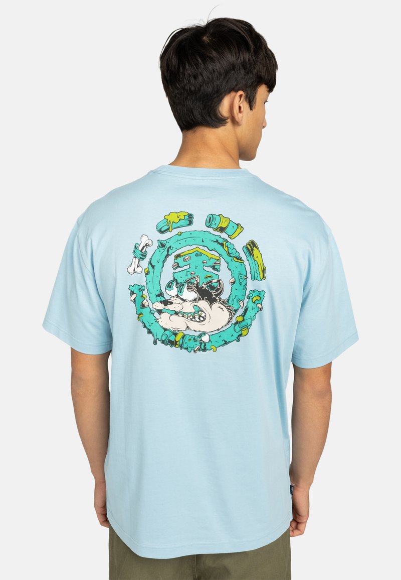 Light blue cotton t-shirt featuring a colorful graphic of a dog surrounded by bones and abstract shapes on the back. Short sleeves, relaxed fit.