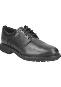 Chaussure en cuir noir avec une tige texturée, bout rond et six œillets. Semelle en caoutchouc épaisse avec un motif de semelle pour une meilleure adhérence. Design classique à lacets.
