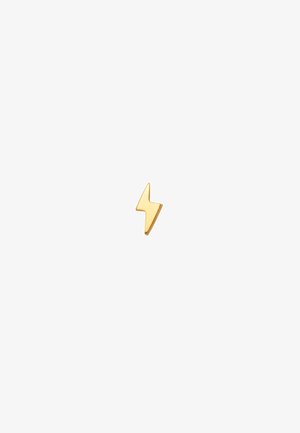 Guld lynlignende nål med en glat, skinnende overflade og et moderne design, der har skarpe vinkler og en minimalistisk stil.
