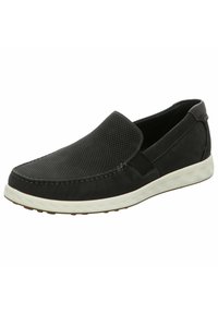 Scarpe slip-on nere con tomaia in rete testurizzata, suola in gomma bianca a contrasto e dettagli di cucitura ordinati lungo i bordi.