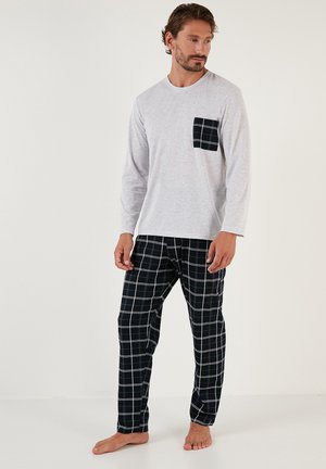 Gray long-sleeve shirt with a black checkered pocket, paired with black and white plaid pants. Lightweight fabric, relaxed fit.