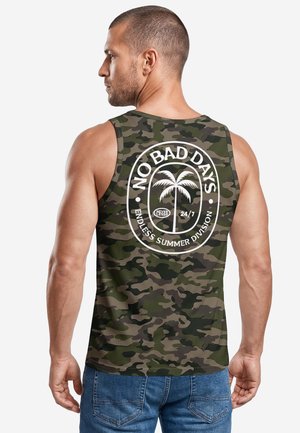 Man in camouflage sleeveless shirt with white graphic of palm tree and text "No Bad Days Endless Summer Division" on back.