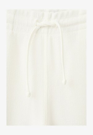 Witte gebreide broek met een elastische tailleband en een vastgeknoopt trekkoord aan de voorkant.