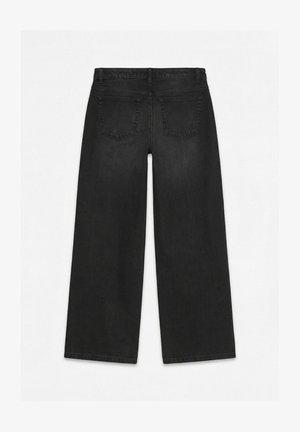 Zwarte wijde jeans gezien van achteren, met riemlussen, twee achterzakken en een ontwerp met een hoge taille tegen een effen achtergrond.