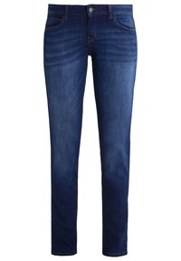 Tmavě modré džínové kalhoty s úzkým střihem, které mají pět kapes, zapínání na zip a knoflík a jemné blednutí na stehnech.