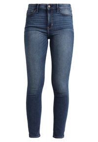 Jeans skinny blu scuro in denim, caratterizzati da vita alta, leggero effetto usurato sul davanti e classico design a cinque tasche.