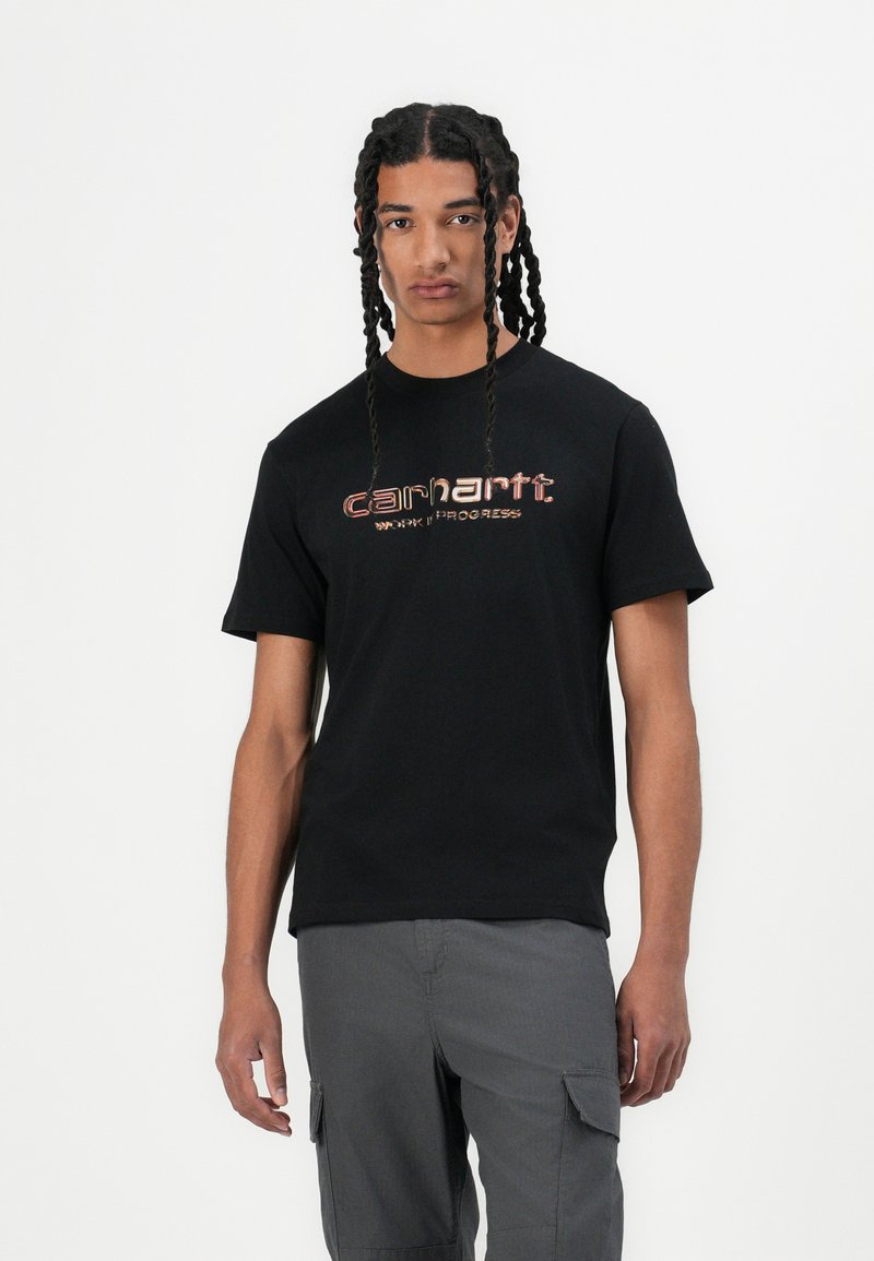 Black short-sleeve t-shirt featuring the Carhartt logo in red and white on the front, made of soft fabric with a relaxed fit.