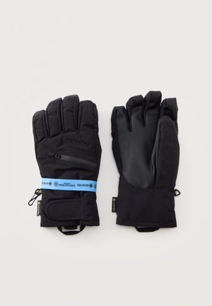 Paire de gants d'hiver noirs isolés Gore-Tex, l'un montrant le dos matelassé avec poche zippée, l'autre montrant la paume lisse et le pouce texturé.