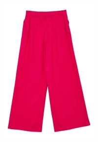 Pantalons à jambes larges en rose vif. Fabriqués en tissu lisse avec une taille élastique et deux poches arrière. Design à l'avant plat.