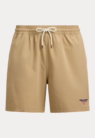 Béžové plavecké šortky s elastickým pásom a bielou šnúrkou, s malým logom Polo Sport Ralph Lauren na spodnej ľavej nohe.