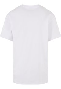 Tricou alb cu mânecă scurtă, guler rotund, material din bumbac neted, croială lejeră, fără motive sau embellishementuri, vedere din spate.