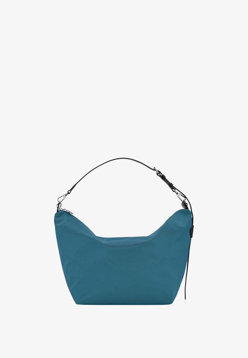 Taschenfarbe in Türkis, gefertigt aus weichem, strukturiertem Material. Verfügt über eine geschwungene Form, einen verstellbaren schwarzen Trageriemen und Metallelemente als Akzent.