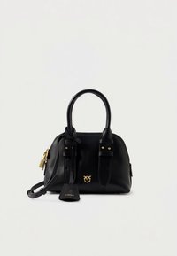 Black leather handbag with two top handles, gold hardware, and a front logo. Features a detachable strap and buckle accents.