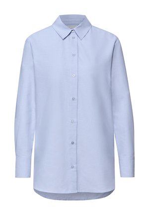 Vaaleansininen pitkähiha paita, jossa on napitettava etuosa, klassinen kaulus ja kaareva helma. Valmistettu sileästä, kudotusta kankaasta.