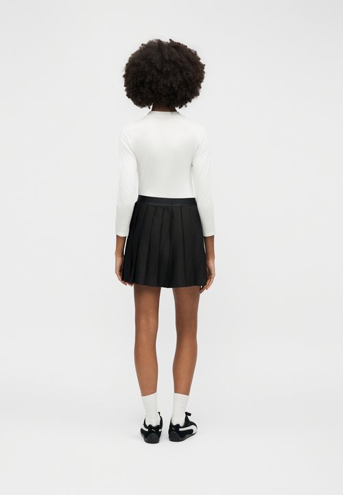 PUMA WARDROBE - Pleated skirt - black — photo 4