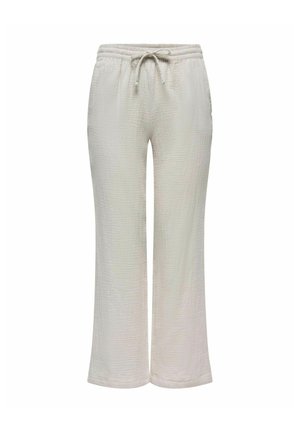 Vaaleanbeiget leveät housut, jotka on valmistettu teksturoidusta kankaasta. Housuissa on joustava vyötärö, jossa on nyörivedin, ja rento istuvuus.