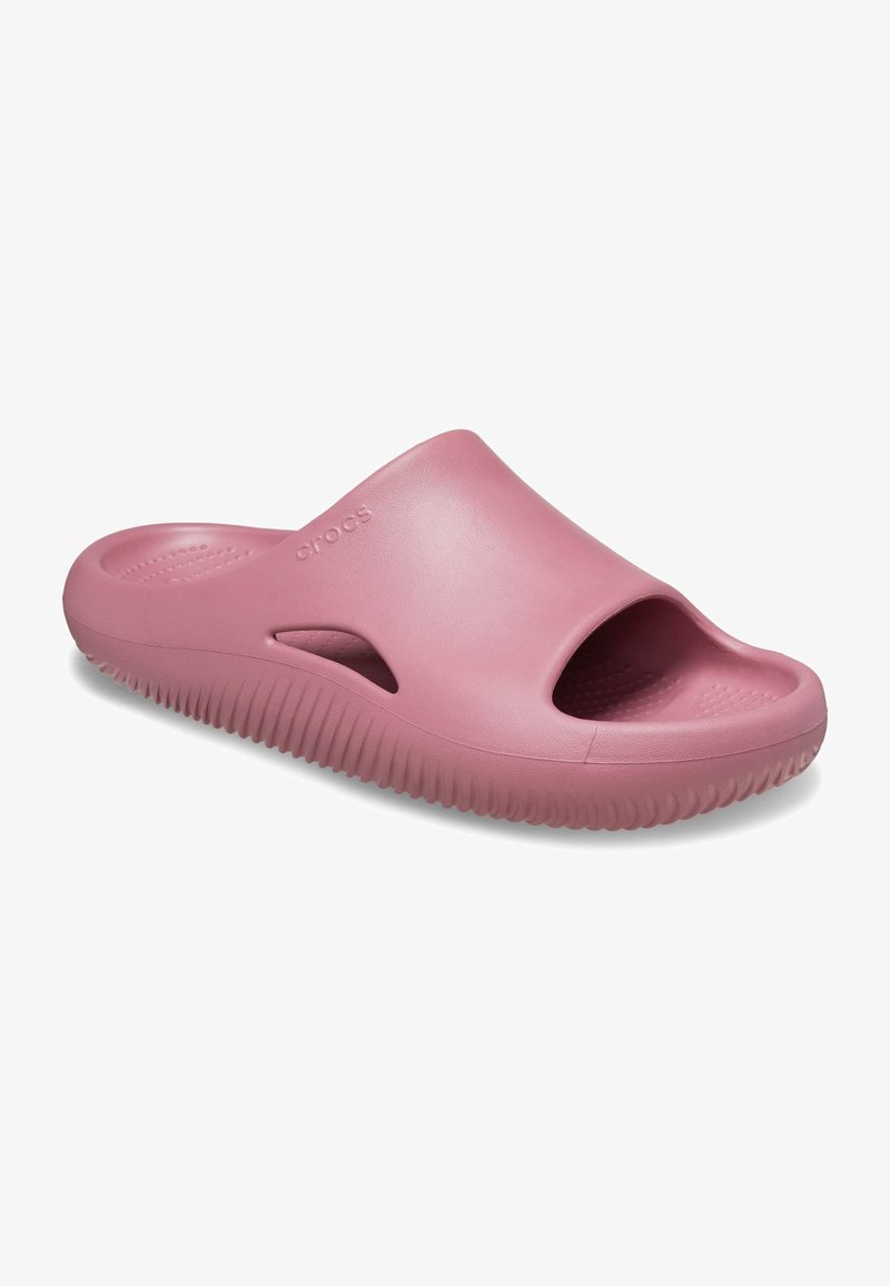 Pink rubber slide sandal with open toe, side cutouts, and a textured sole. Features a thick, ridged outsole for grip and comfort.