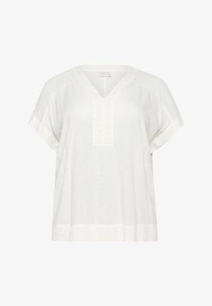 Top de lino blanco con escote en V y mangas cortas. Presenta un corte recto y una textura sutil. No se observan patrones ni adornos.
